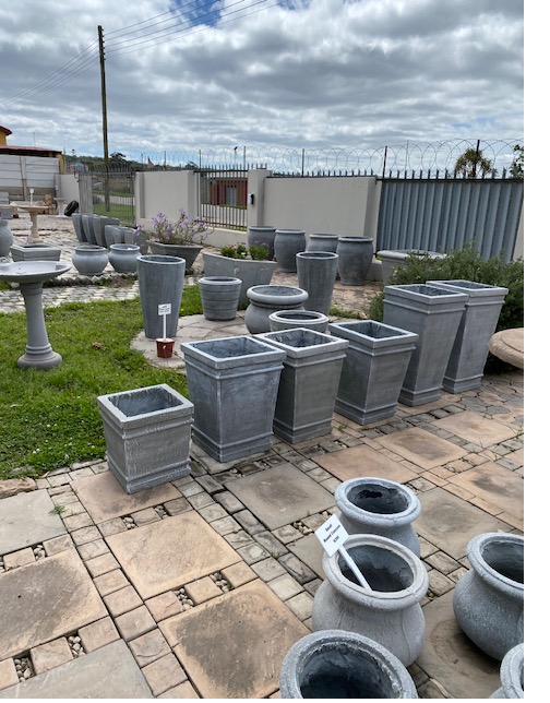 A display of cement garden pots